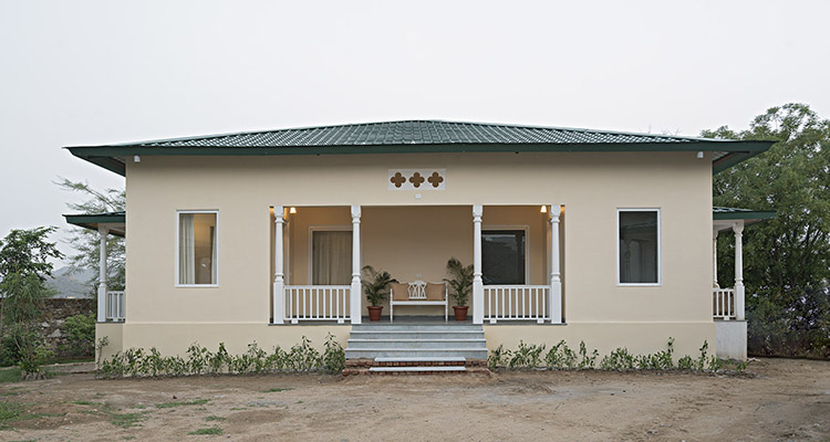 Cozy cottages surrounded by lush greenery and stunning sunsets at Sariska Manor, Rajasthan