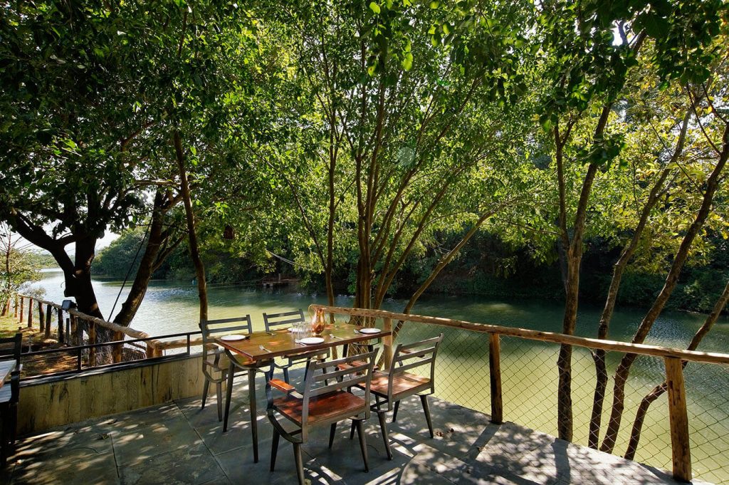 dining space amidst water and nature