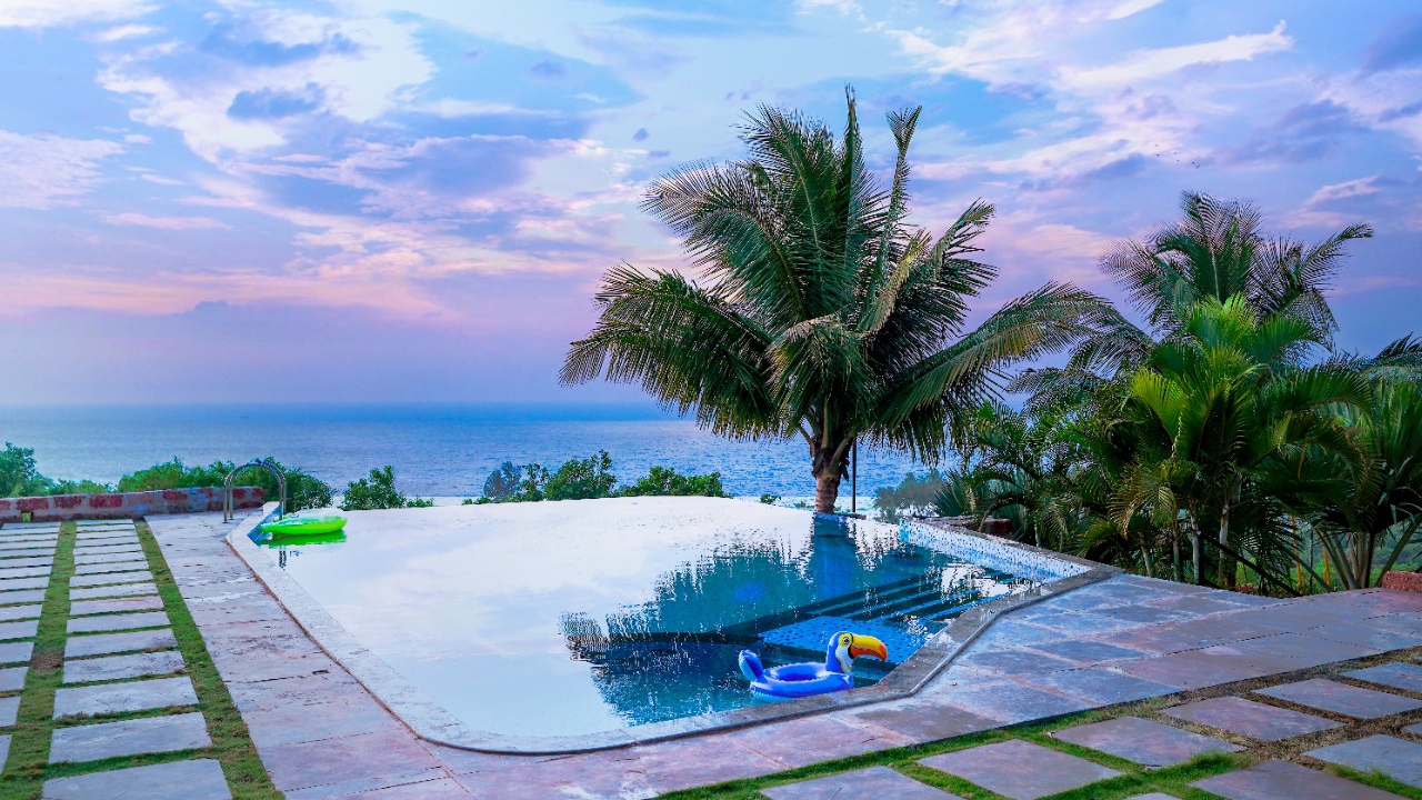 Best private resorts in India: konkan coast beach resort swimming pool overlooking the sea view 