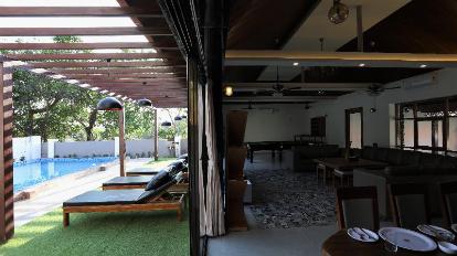 villa in alibaug near the beach: alibaug beach escape sun-lounger and dining area view