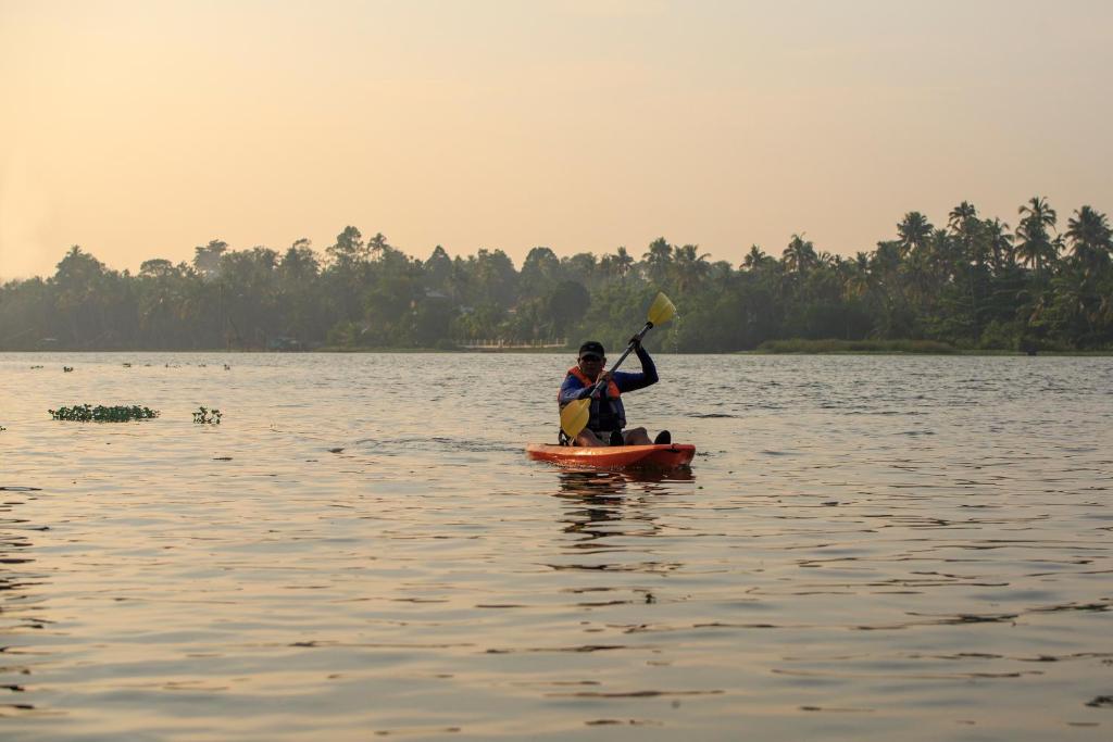 Yoga retreats in Kerala- Wellness Ayurveda Retreat kayaking view