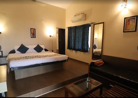 konkan coast beach resort bedroom with amenities view