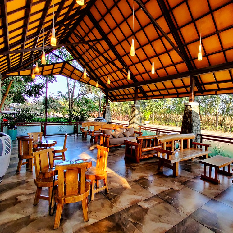 resorts near pune in monsoon: nature's holistic wellness retreat lounge view