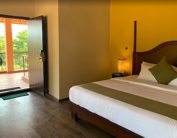 Sakleshpur resort for family- bed and balcony view