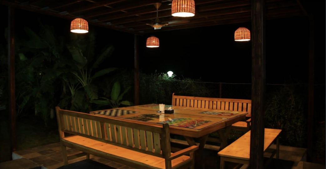 Privy Stays Happyland Private Villa, Alibaug, Outdoor sitting area to relax and play board games. 