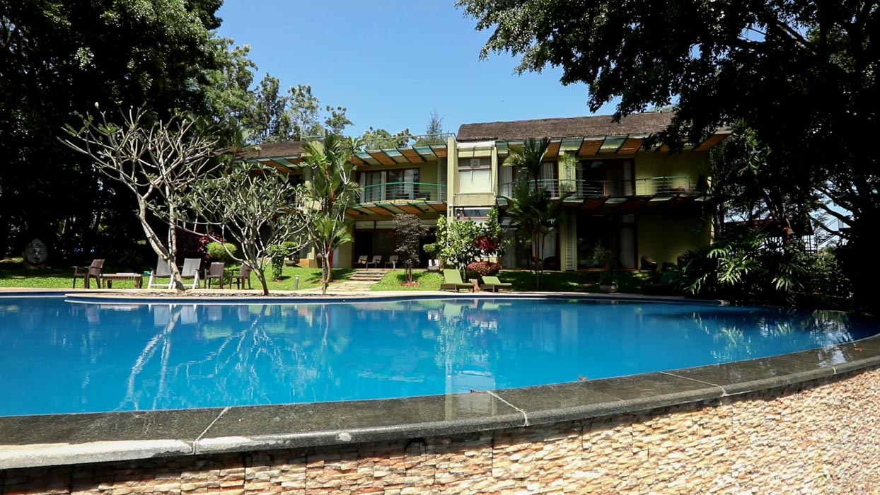 monsoon getaways near bangalore: Riverfront Family Resort pool view