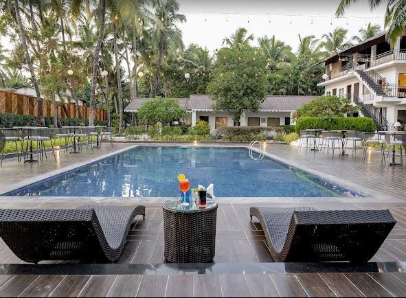 Resorts For Corporate Outing Near Pune: tranquil tropical retreat pool view