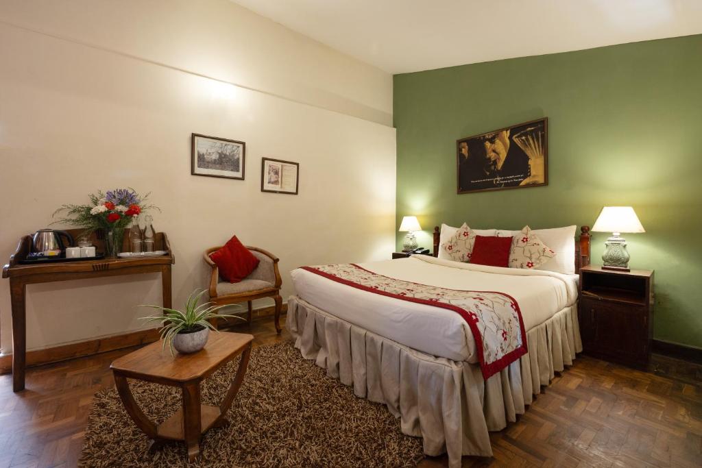 Sherlock-themed spacious bedroom at the Mystery Mansion, one of the best boutique resorts in Ooty