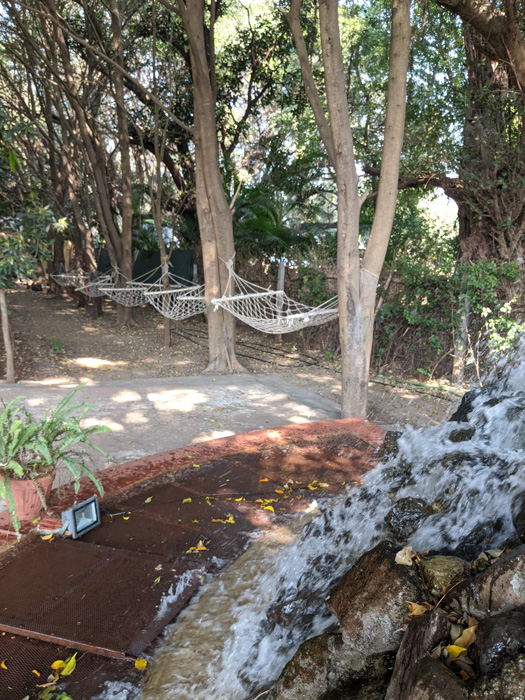 Outdoor hammock and sitting area at the Eco Farm Stay in Panchgani- a perfect place near Mumbai to connect with nature and indulge in the art of Yoga!