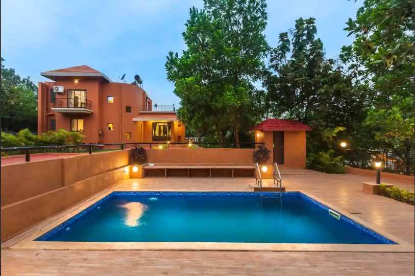 Swimming pool at the Pinjal River Retreat in Palghar, one of the best riverfront resorts near Mumbai