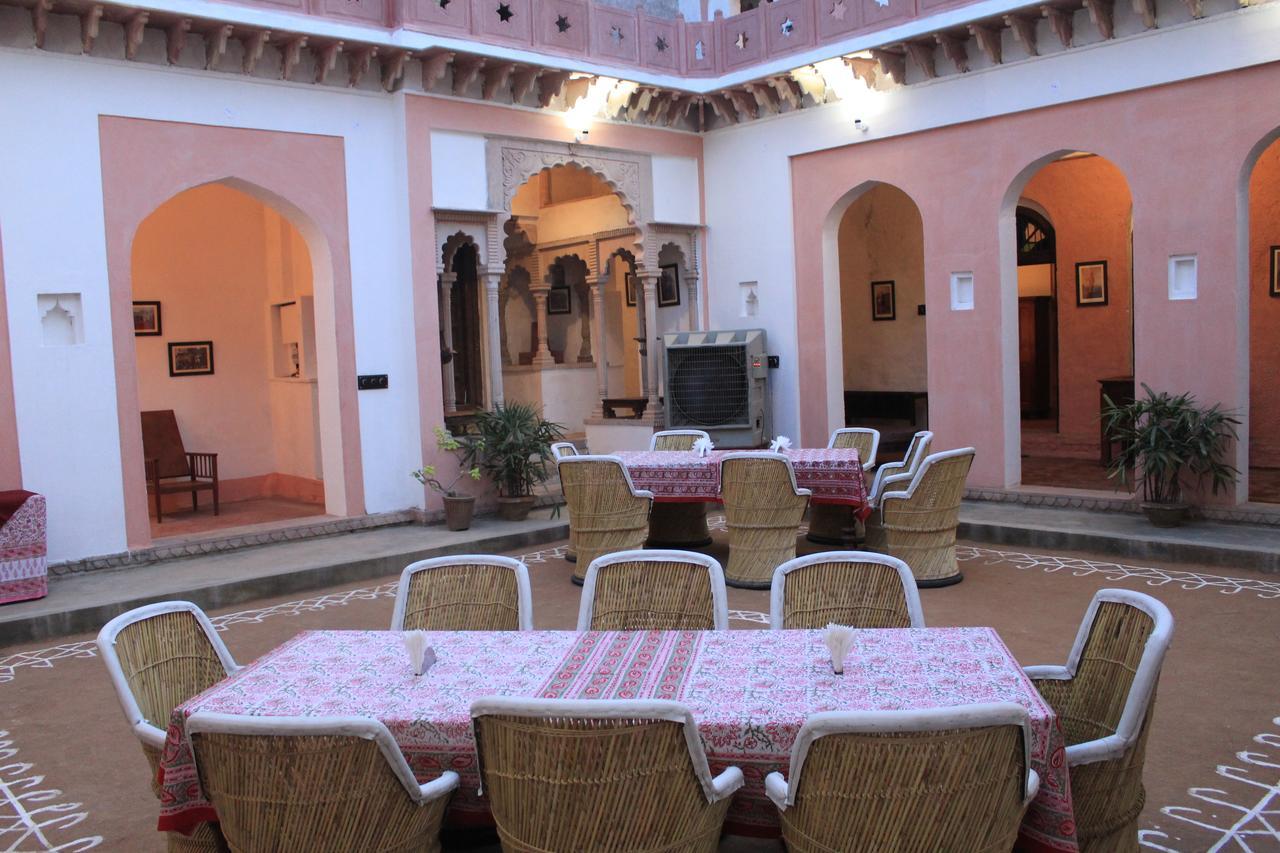 Fort Stay Near Delhi At The Lake View Palace- dining area in the courtyard