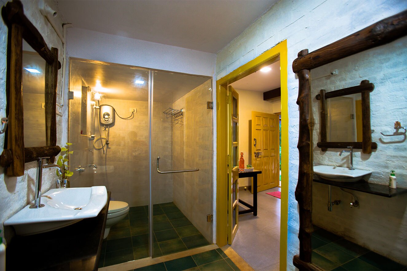 well-maintained bathroom with bathtub at the Cottage Homestay resort in Alibaug