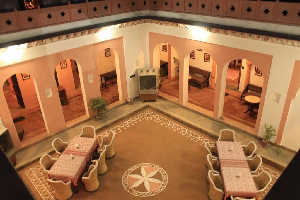 Fort Stay Near Delhi At The Lake View Palace- dining area in the courtyard