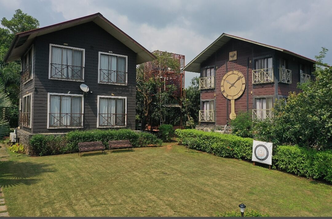 Exterior view of the Scenic Mountain Resort, one of the best resorts in Igatpuri with activities